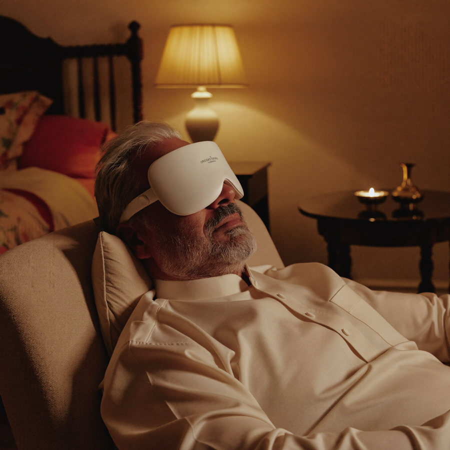 Elderly Indian man relaxing while wearing an eye-care device